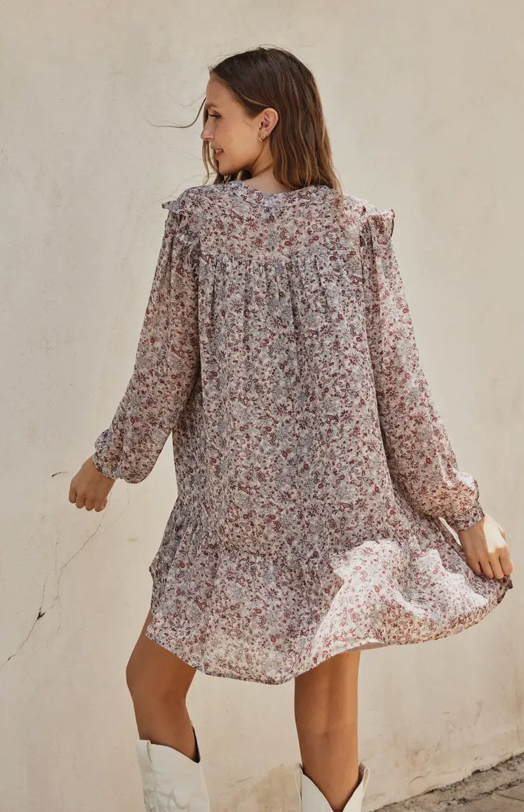 Girl wearing paisley ruffled swing dress